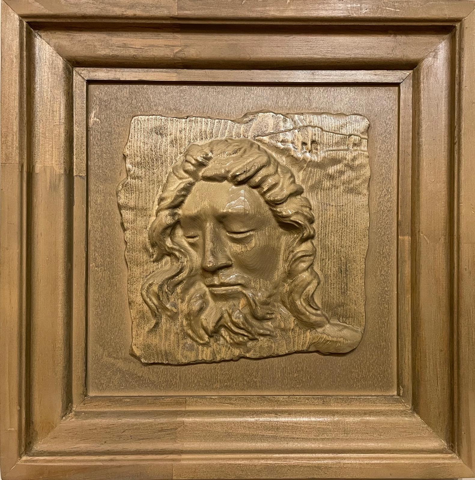Carved framed portrait of Christ with flowing hair and beard