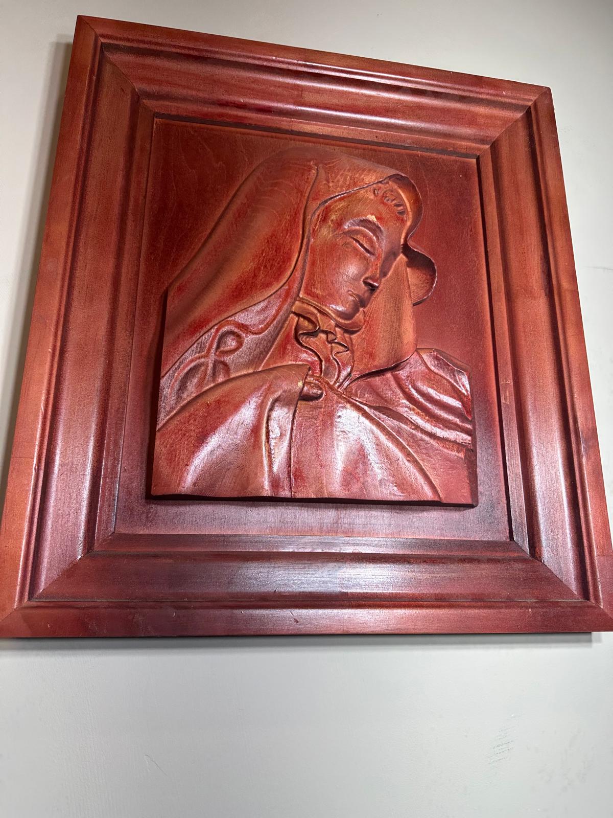 Carved Madonna portrait in red mahogany frame