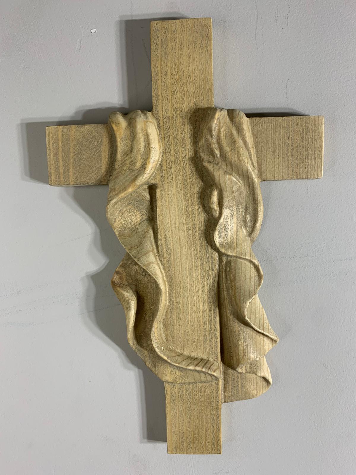 Carved cross with draped shroud in pale wood